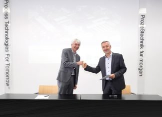 Johannes Wick, CEO Grains & Food at Bühler, and Dr Antonio Fernández, chairman of the executive board at Hosokawa Alpine at the signing of the agreement Photo Bühler