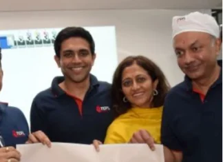 The Kanoria family holding the auspicious test print at the inaugural of the new K&B Rapida multicolor packaging press at TCPL's Goa plant