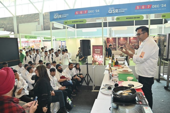 Campaign Ambassador Chef Ajay Chopra, European Union's More Than Food interacting with the audience at the live cooking show at SIAL India 2024. European