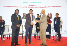 Vijay Sood presents a momento to Nitin Sanduja of Buhler India alongside the Intrapack exhibition at the first FoodTekPack Conference on 11 December 2025 at the Greater Noida Expo. Standing to their left is Ainan Shahidi. Behind them on the stage, from left to right, are Aditi Jhala, Bhushan Yengade, Himanshi Mahajan, and Sandeep Ghosh Photo PSA/IPAMA