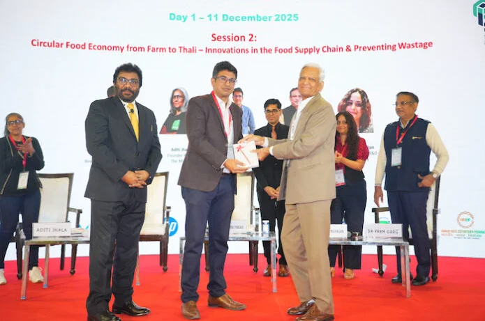 Screenshot 2026-06-18 at 1.05.03 PM Vijay Sood presents a momento to Nitin Sanduja of Buhler India alongside the Intrapack exhibition at the first FoodTekPack Conference on 11 December 2025 at the Greater Noida Expo. Standing to their left is Ainan Shahidi. Behind them on the stage, from left to right, are Aditi Jhala, Bhushan Yengade, Himanshi Mahajan, and Sandeep Ghosh Photo PSA/IPAMA